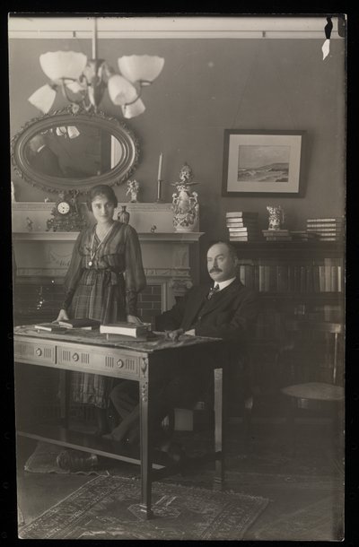 Portrait of the dentist Dr. Gibson and a woman in his residence by Byron Company